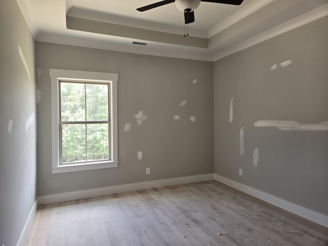 1646 Ritz Way Unit 4, Soddy Daisy, TN 37379 - unfurnished room with healthy amount of natural light, a tray ceiling, wood finished floors, ceiling fan, and ornamental molding