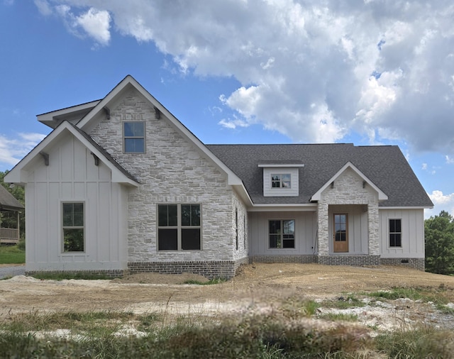 1646 Ritz Way Unit 4, Soddy Daisy, TN 37379 - view of front facade with board and batten siding, roof with shingles, and stone siding