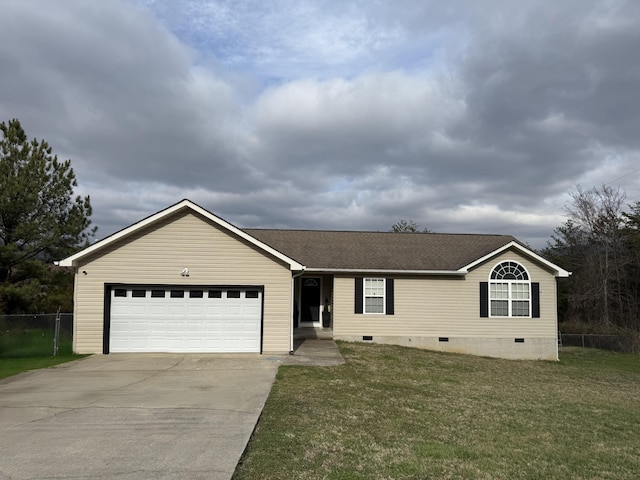 view of front of home featuring a front lawn and a garage