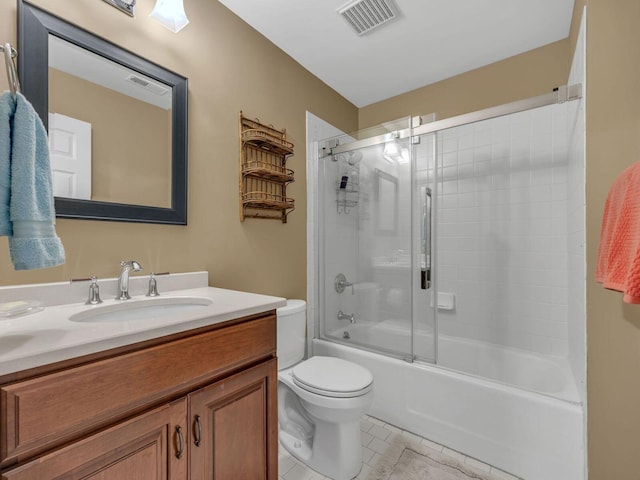 full bathroom featuring vanity, combined bath / shower with glass door, and toilet