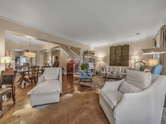 living room with crown molding and wood-type flooring