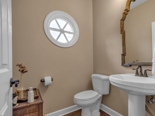 bathroom with sink and toilet