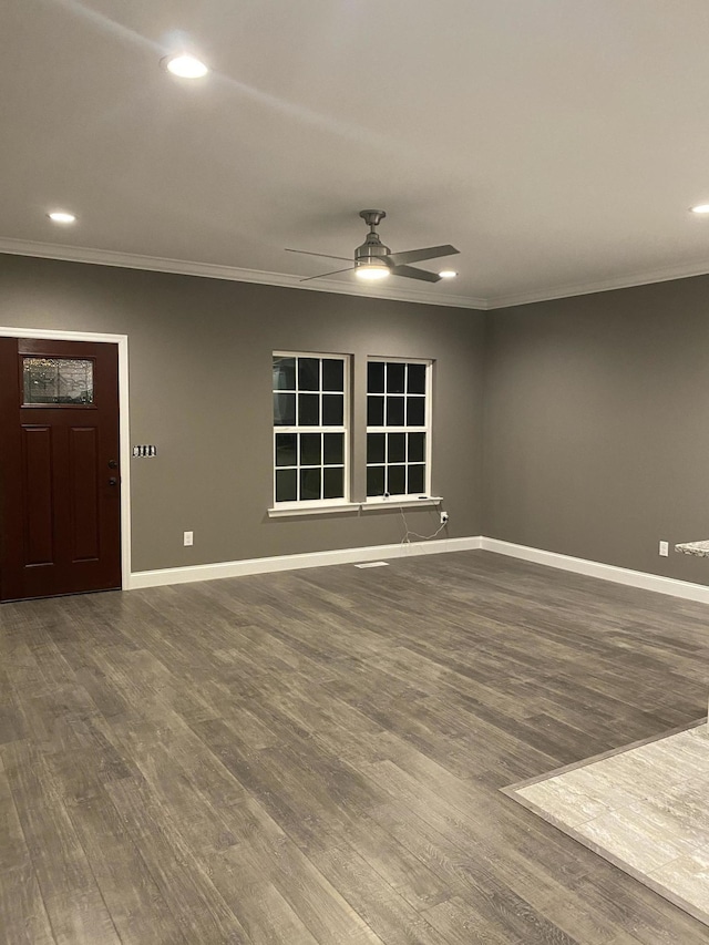 interior space with crown molding, ceiling fan, and dark hardwood / wood-style flooring