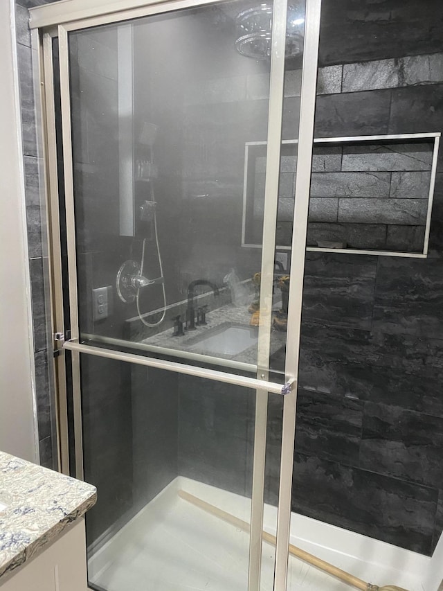 bathroom with tiled shower