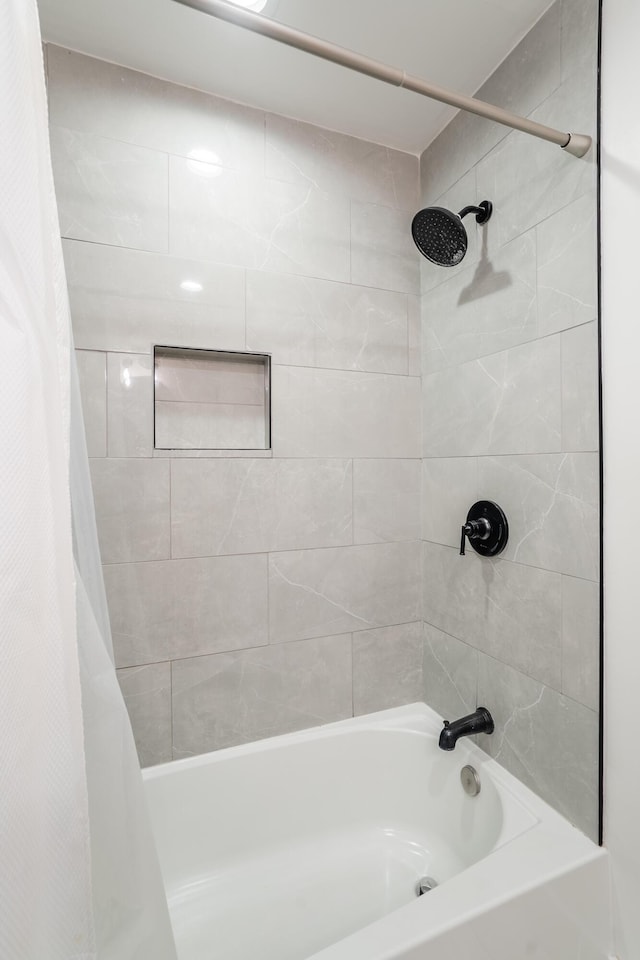 bathroom featuring shower / tub combo with curtain