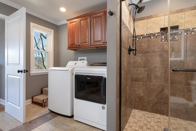 laundry area with light tile patterned floors, ornamental molding, washer and dryer, laundry area, and baseboards