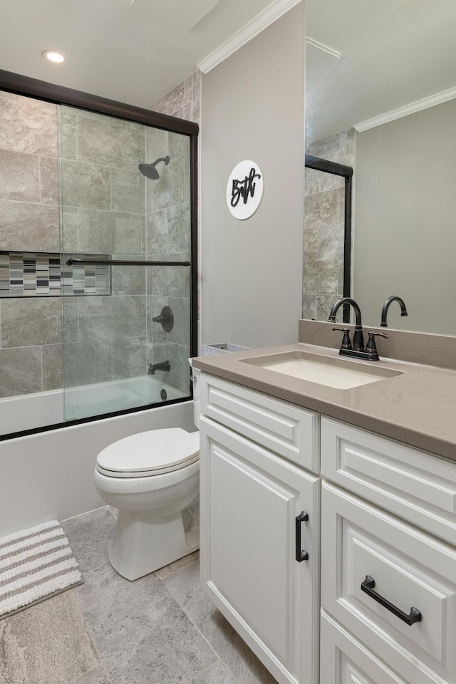 full bath featuring toilet, enclosed tub / shower combo, crown molding, and vanity