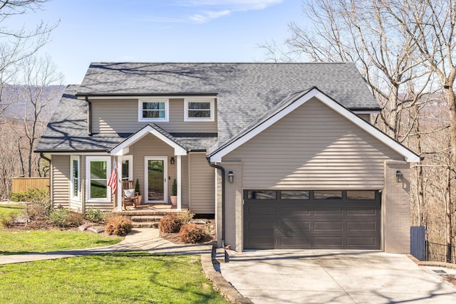 traditional home featuring a shingled roof, concrete driveway, and an attached garage