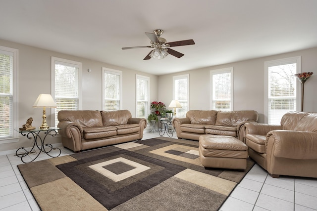 living room with ceiling fan and light tile patterned floors