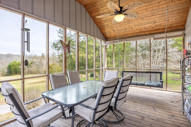 sunroom featuring ceiling fan, vaulted ceiling, and wooden ceiling