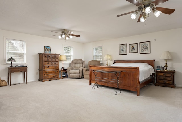 bedroom featuring light colored carpet and ceiling fan