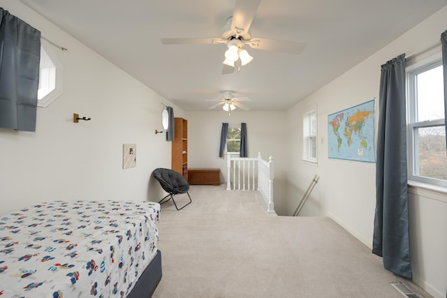 carpeted bedroom featuring ceiling fan