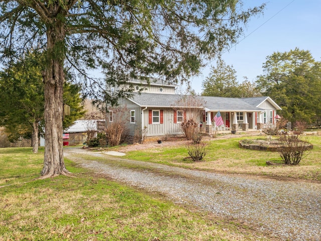 ranch-style home featuring a front yard