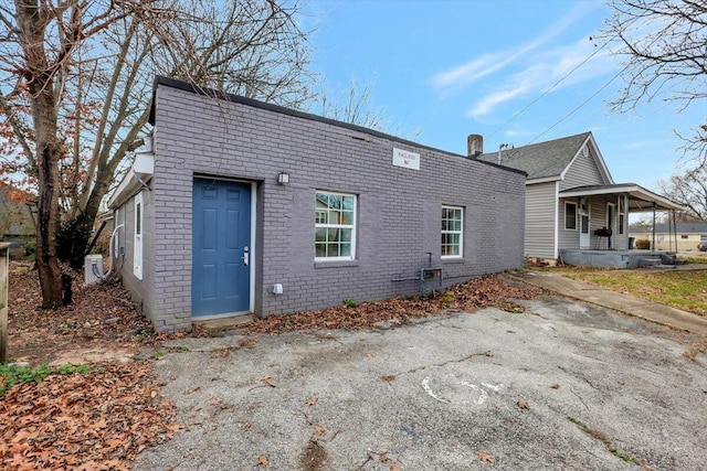 back of property with covered porch