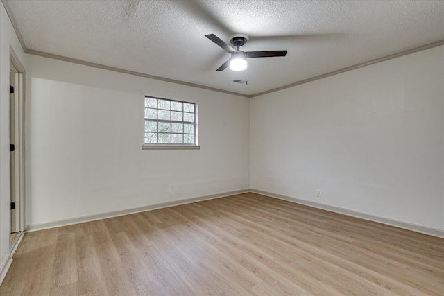 empty room with ornamental molding, a textured ceiling, ceiling fan, and light wood-type flooring