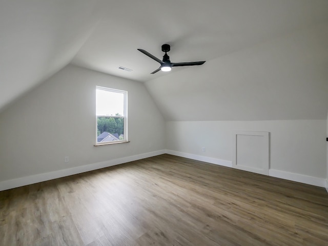 additional living space featuring vaulted ceiling, ceiling fan, and hardwood / wood-style floors