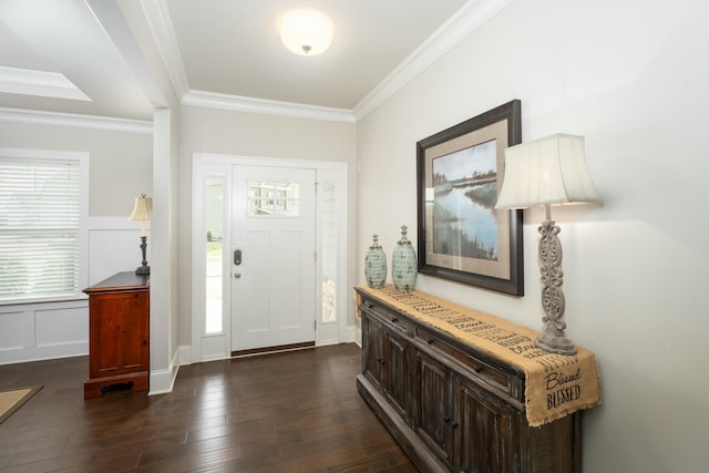 entrance foyer featuring dark wood-type flooring and ornamental molding