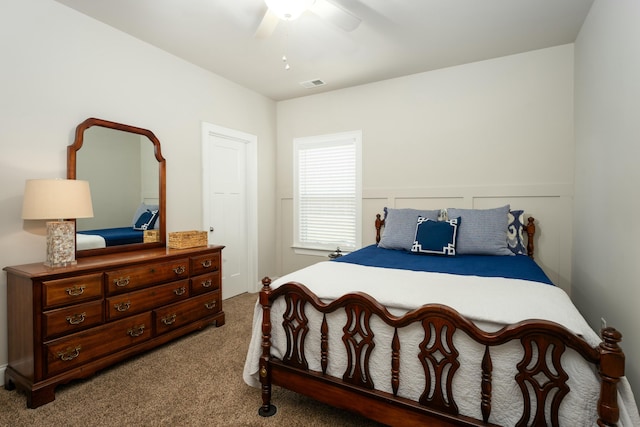 bedroom with ceiling fan and carpet