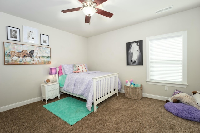 bedroom featuring ceiling fan and dark colored carpet