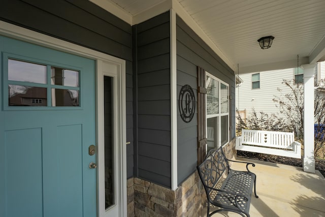 entrance to property with covered porch