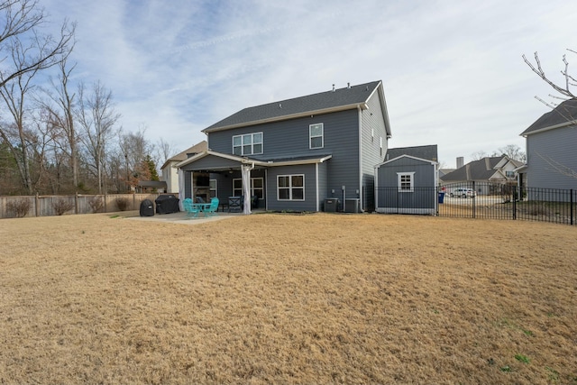 rear view of property with cooling unit, a lawn, a shed, and a patio area