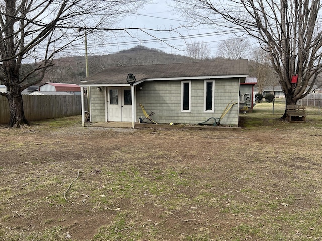 rear view of house with a lawn