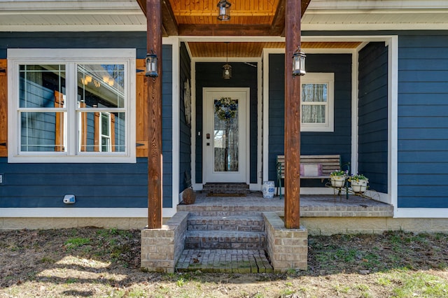 property entrance with covered porch