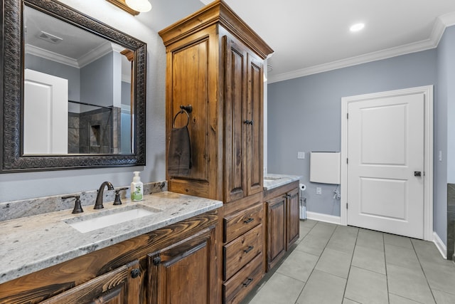 full bathroom featuring double vanity, ornamental molding, a sink, and tile patterned floors