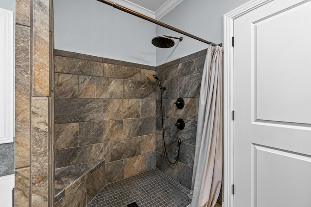 bathroom with a stall shower and ornamental molding