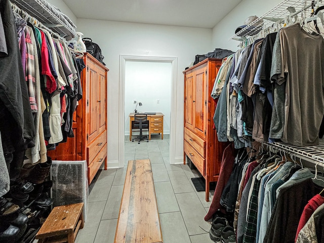 spacious closet featuring tile patterned floors