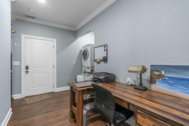 office area with stacked washer and dryer, visible vents, baseboards, dark wood finished floors, and crown molding