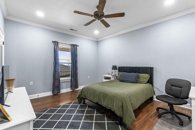 bedroom with visible vents, crown molding, and wood finished floors