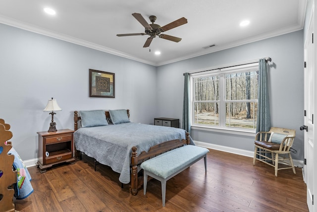 bedroom with baseboards, visible vents, dark wood finished floors, crown molding, and recessed lighting