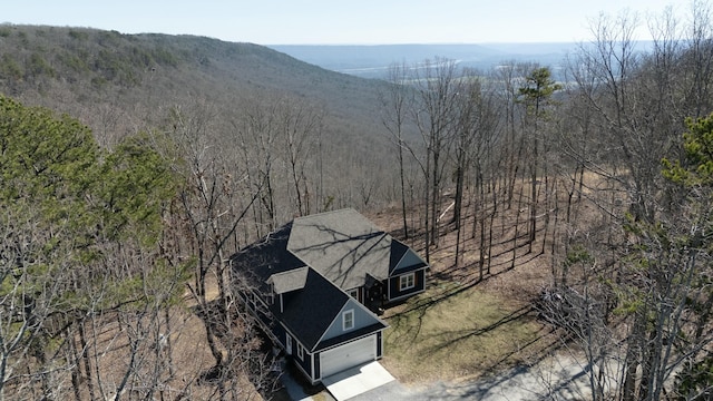 drone / aerial view featuring a view of trees