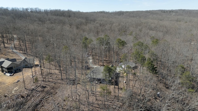 birds eye view of property with a rural view and a wooded view