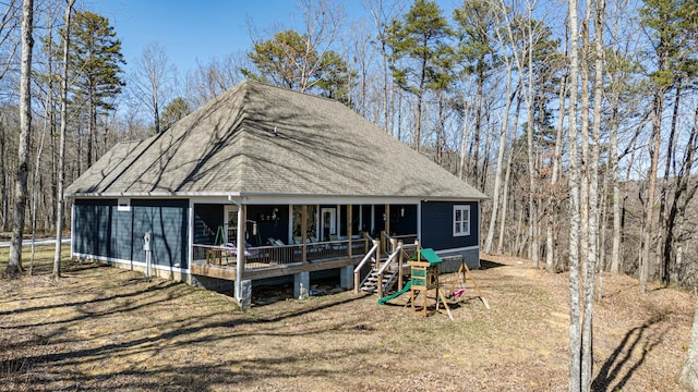 exterior space featuring a shingled roof