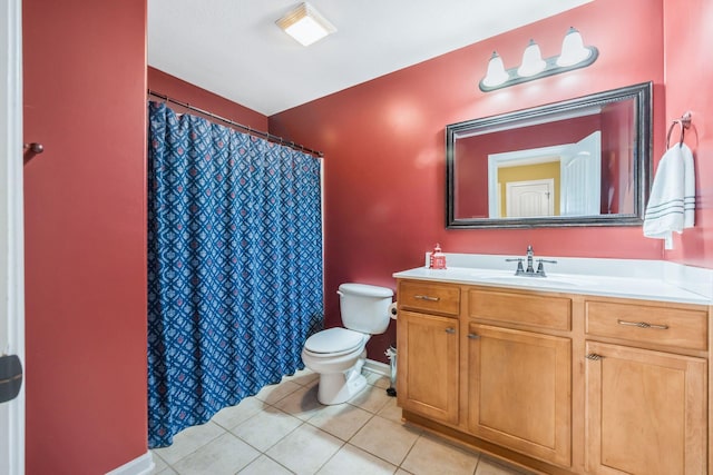 full bath featuring toilet, vanity, a shower with curtain, baseboards, and tile patterned floors