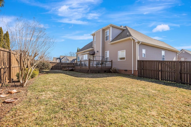 exterior space with a fenced backyard and a wooden deck