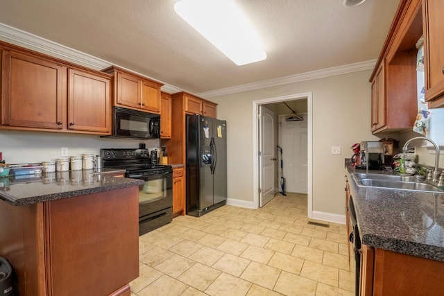 kitchen featuring a textured ceiling, black appliances, light tile patterned flooring, crown molding, and sink