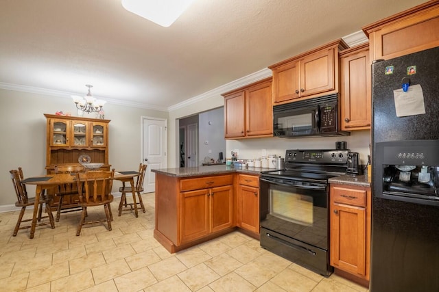 kitchen featuring kitchen peninsula, an inviting chandelier, black appliances, and crown molding