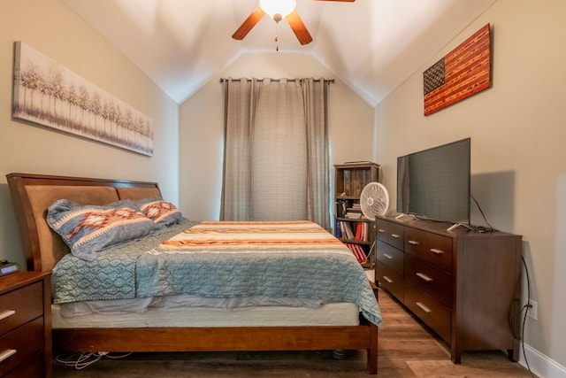 bedroom featuring vaulted ceiling, hardwood / wood-style floors, and ceiling fan