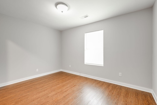 spare room featuring hardwood / wood-style flooring