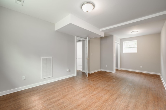 spare room featuring light wood-type flooring