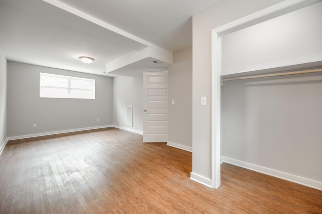 basement featuring light hardwood / wood-style floors