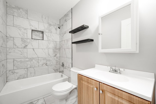 full bathroom featuring tiled shower / bath combo, vanity, and toilet