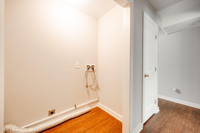 laundry room with dark wood-type flooring, hookup for a washing machine, and electric dryer hookup