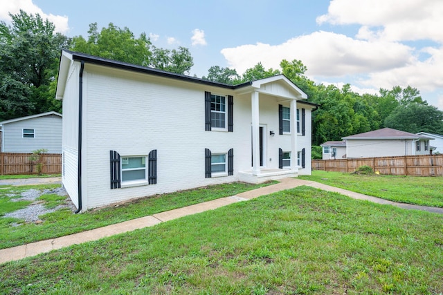 view of front of home with a front lawn