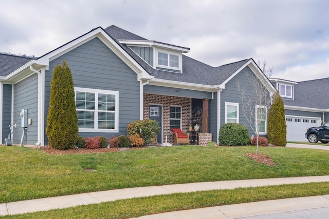 view of front facade featuring a garage and a front lawn