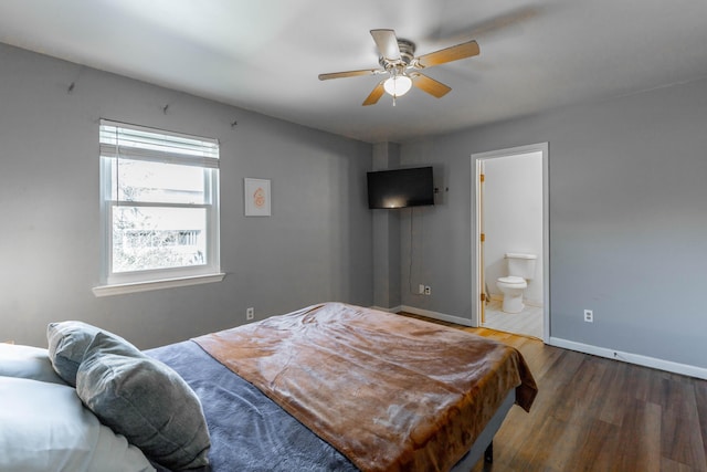 bedroom featuring ceiling fan, wood finished floors, connected bathroom, and baseboards