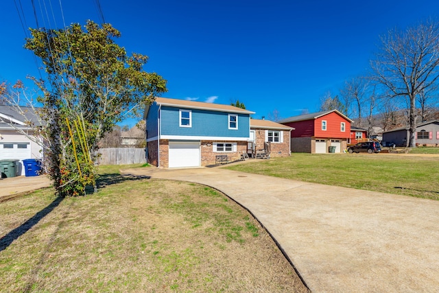 view of front facade featuring driveway, an attached garage, fence, a front lawn, and brick siding